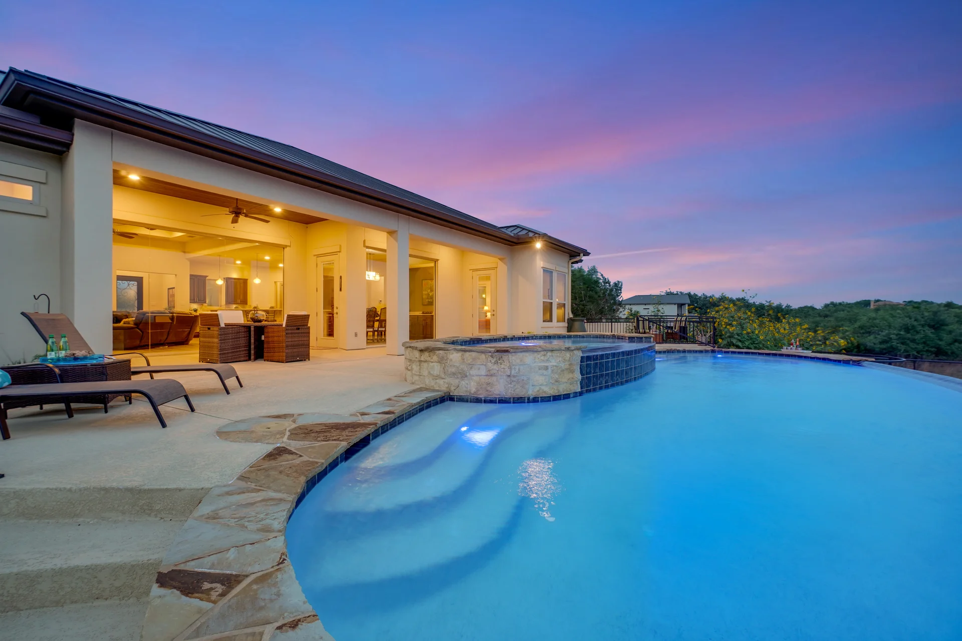 Walking the outside of the home to check the pool cage and landscaping.